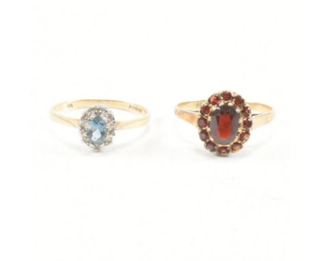 Two hallmarked 9ct gold and gem set rings. A topaz and diamond cluster ring set with a central oval cut topaz framed by illus