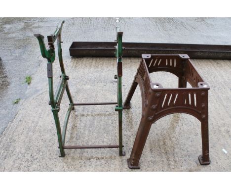 Two vintage industrial metal stands. One rectangular with tapered supports marked 'A138' H61cm, the other painted green H94cm