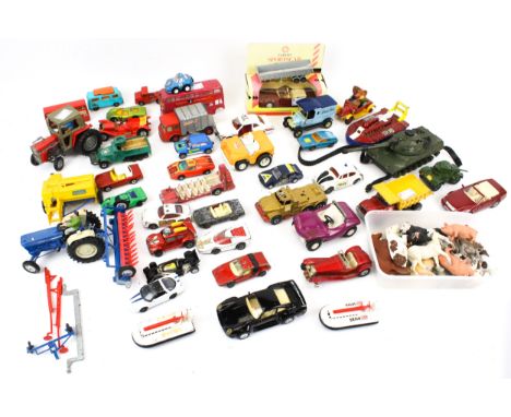 A collection of diecast vehicles and Britains plastic animals. Commercial and Industrial vehicles, including Dinky, Corgi, et