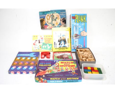 An assortment of vintage toys. Including jigsaw puzzles, microscopes, stencil sets, 'Ker Plunk', etc.