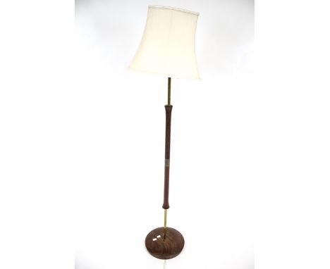 A mid-century modern standard lamp. Having a circular mahogany base with part metal and wood column. H139cm (AF).