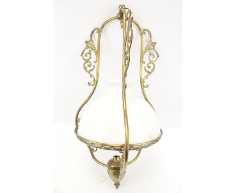 A brass pendant ceiling light with white glass shade. H69cm