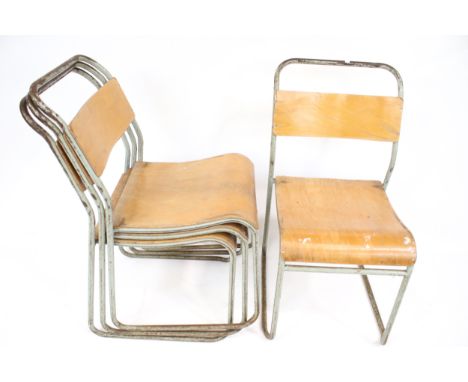 Vintage Industrial: Four  Pel Cox designed 'PEL' mid-century industrial stacking tubular steel and wood chairs. With bent ply