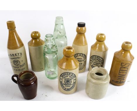A collection of vintage stoneware bottles and two Codd bottles. Including G Ray &amp; Sons Macclesfield, Nisbet's Hawick, 'Mu