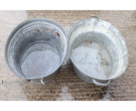 Two vintage galvanised tin baths. Of tapered oval form with twin handles, L71cm &amp; L80cm