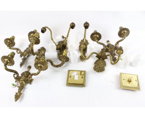 A collection of vintage electric wall brackets and light fittings. The gilt metal structures decorated with scrolls and mould