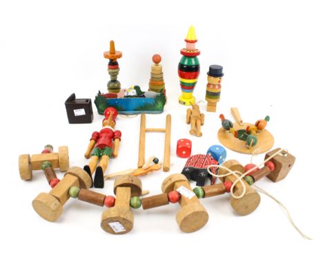 A collection of assorted vintage wooden toys. Including 'Pinocchio', stacking and animated, etc. Max. H24cm