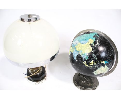 A twelve inch terrestrial globe and a dome top table lamp. Consisting of a 'Levenger Replogle Globes 60 years of Art Deco 193