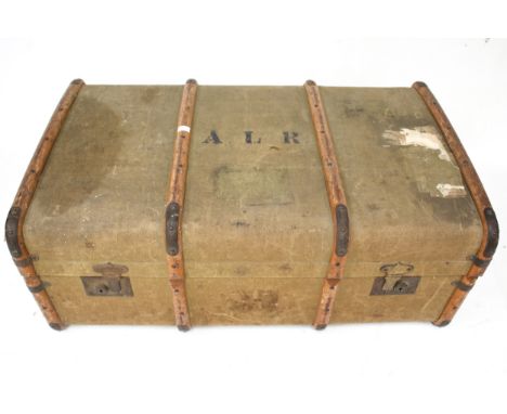 A vintage wooden bound and canvas travel trunk. With leather handles and a 'GWR BRISTOL (TEMPLE MEADS)' paper label and print