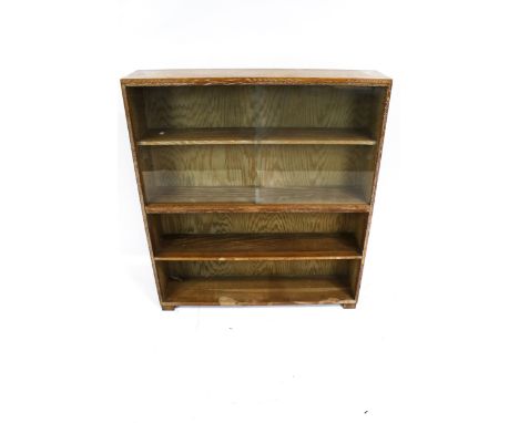 Vintage Retro : A manner of Heals limed oak freestanding bookcase, with two sliding glass doors above two open shelves, on bl