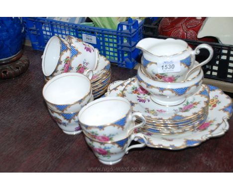 An Aynsley bone china Teaset decorated in floral sprays and scroll border, comprising six Cups and saucers, six Tea Plates, S