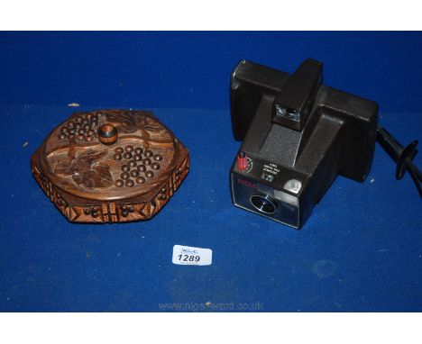 A carved wooden Trinket Box and a Polaroid Camera