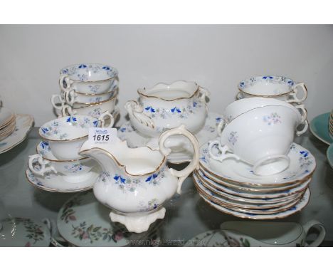 A pretty hand painted 19th c. Tea/Coffee, white ground with blue and white and comprising eight Tea Cups, five Coffee Cups, e