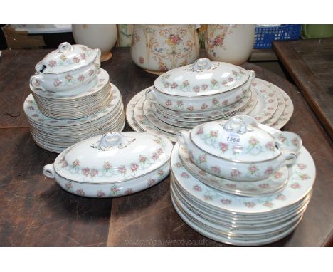 A Booths Dinner Service having floral and swag pattern, comprising twelve dinner and dessert plates, eleven tea plates, two l