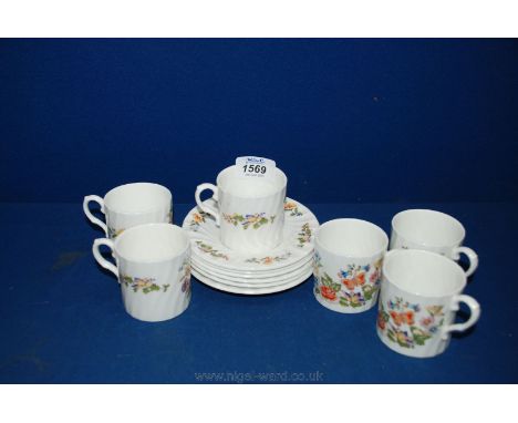 An Aynsley Coffee set comprising six coffee Cans and saucers in 'Cottage Garden' pattern