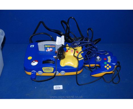 A Nintendo 64 N64 Pokemon Pikachu special edition video games Console with controller and Yoshi's Story game.