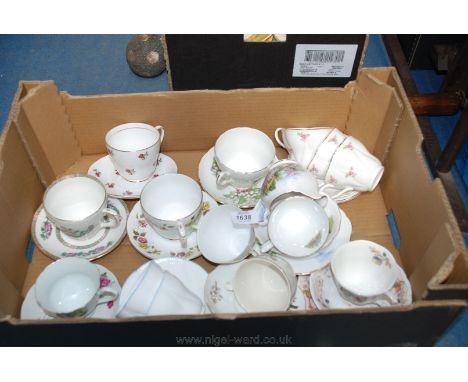 A quantity of pretty Cups and Saucers including Royal Doulton ''Autumn'', Regency Lily of the Valley, Shelley strawberries, e
