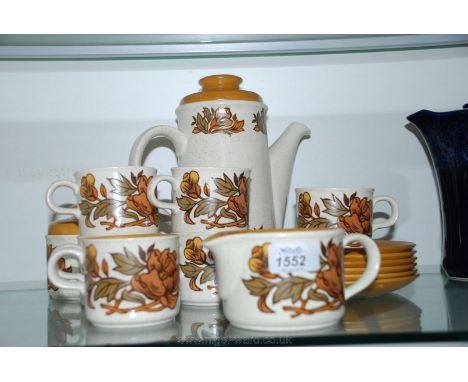 A Palissy coffee pot, six cups and saucers, sugar bowl and milk jug