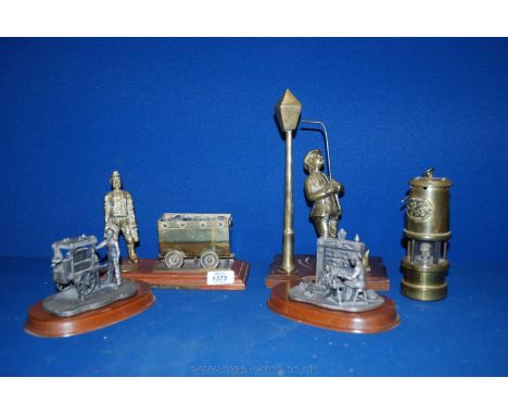 A quantity of Brass and metal ornaments including organ grinder, Welsh miner, lady at a spinning wheel and Davey Lamp.