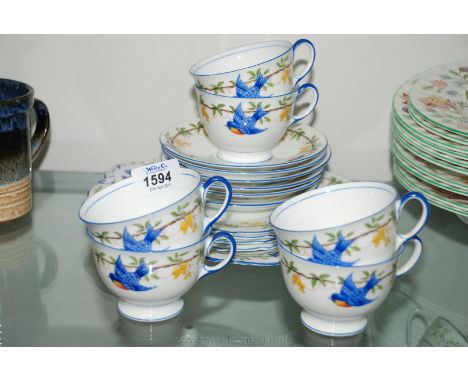A pretty Aynsley part Teaset, white ground with bluebirds and yellow floral decoration, comprising six Cups, four Saucers, fo