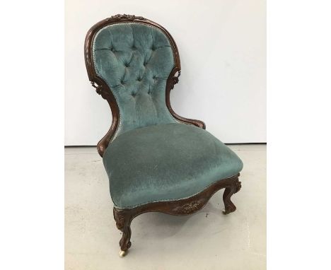 Mid Victorian carved walnut upholstered spoon back chair, powder blue button back and seat in floral carved showwood frame wi