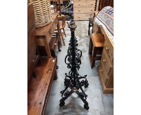 Two early 20th century wrought iron oil lamp stands converted into standard lamps