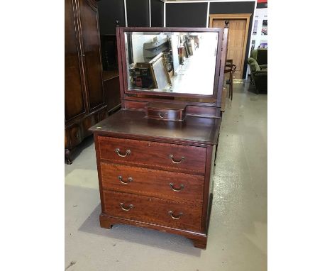 Edwardian mahogany inlaid dressing chest with mirrored back single jewellery drawer above and three drawers below on bracket 