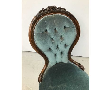 Mid Victorian rosewood upholstered spoon back chair, with powder blue velvet button upholstered back and seat in floral carve