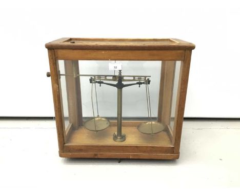 Antique chemists balance scales, glazed case with rising front, 44cm wide