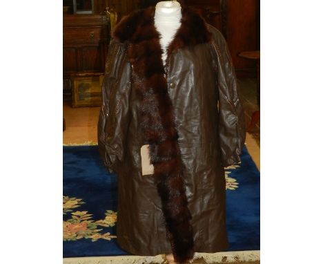 A brown ladies leather coat, having mink fur lining. Approx size M