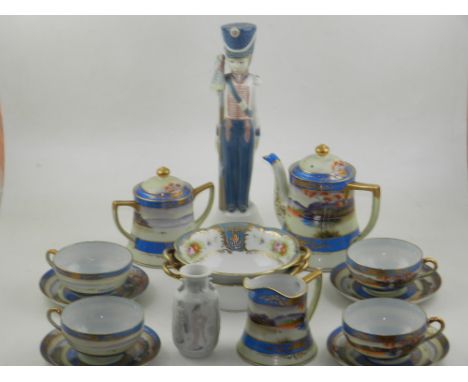 A Lladro figurine of a boy soldier, a small Lladro vase, two Noritake twin handled bowls, and a Japanese eggshell tea service