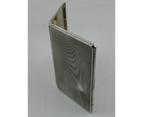 An Art Deco gentleman's silver cigarette case, with engine turned design, hallmarked London 1931, by Thomas William, weighs 1