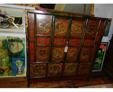 An unusual 19th century Chinese green and crimson painted house keepers cabinet, decorated with vignettes of dragons and phoe