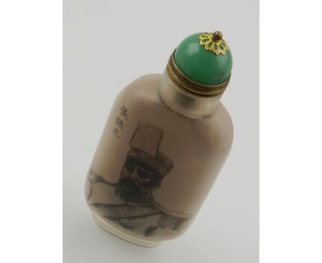 A Chinese glass snuff bottle, decorated with head and shoulder portrait, H: 9cm