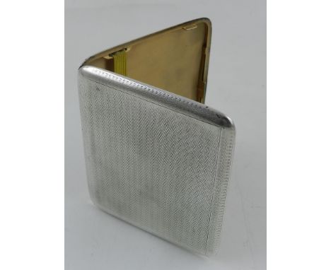 An Art Deco silver cigarette case, with engine turned decoration and gilded interior, hallmarked 1928, by Aide Brothers, weig