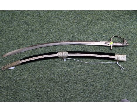 Early 20th century hand made Indian ceremonial sword in velour scabbard with jaguar head design hilt. 