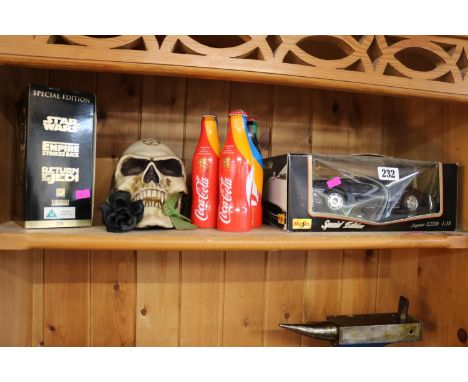 3 London Olympic Torch Relay Coca Cola bottles, Maisto model Jaguar, Star Wars Trilogy Video set and a Model Skull 