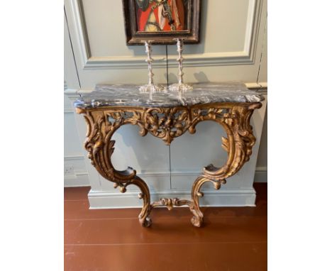 Italian gilt-wood serpentine console table with later Bardiglio grey marble top. Mid-18th Century.Ex Condylis Collection  Dim