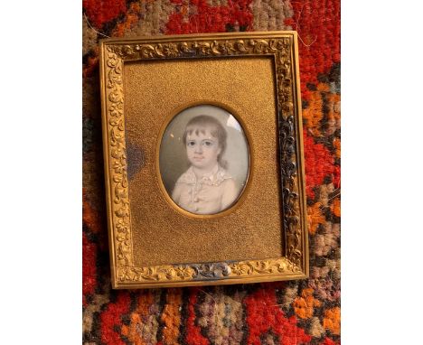 [?]Property of a Gentleman An oval portrait miniature of a small child in a rectangular frame. Early 19th Century. Dimensions