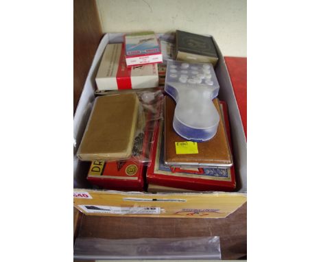 A collection of playing card packs, draughts and other pastimes. 