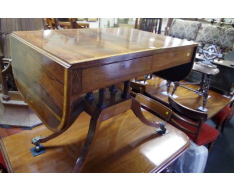 A Regency rosewood, satinwood crossbanded and line inlaid sofa table,&nbsp;92cm wide when closed.&nbsp; 