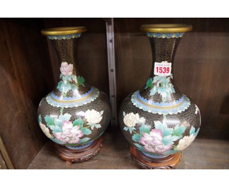 A pair of Chinese cloisonne enamel vases,&nbsp;26cm high, each on wood stand.&nbsp; 