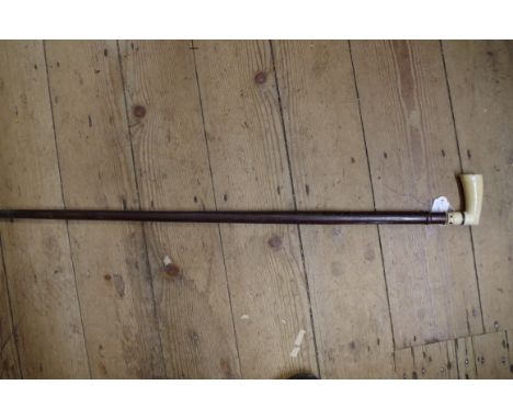 An antique ivory handled hardwood walking stick, with bone inlay to the handle. 