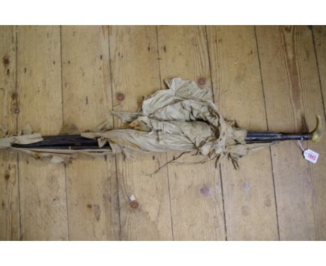 An unusual antique sword stick parasol, with brass mount inscribed 'Mw Gombes, Chichester', with concealed gilt and blued ste