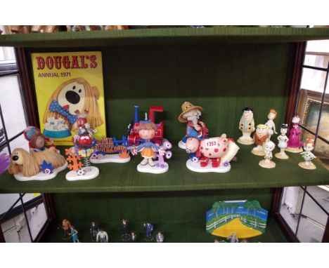 A collection of seven John Beswick 'Flintstones' figures; together with a small collection of 'Wizard of Oz' figures; a simil