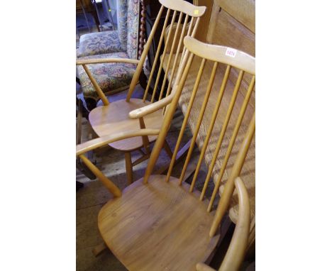 A pair of vintage Ercol rocking chairs. 