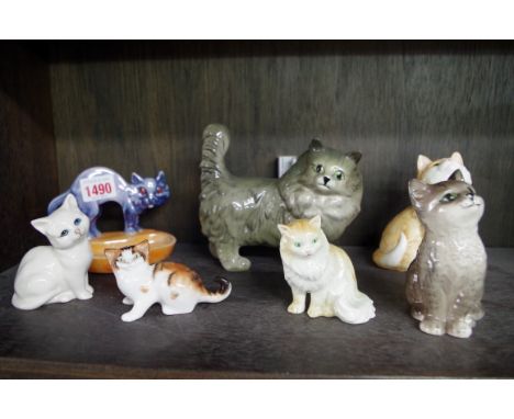 Seven various cat models,&nbsp;to include examples by Beswick; Royal Doulton; and Hummel.&nbsp; 