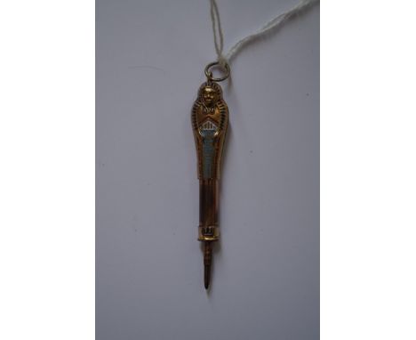 An Egyptian Revival figural gilt and enamel propelling pencil. 