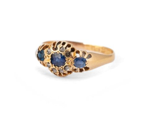 18ct gold ring, central sapphire surrounded by diamonds, flanked by sapphires, 3.1g, size R, hallmarked.  One stone missing