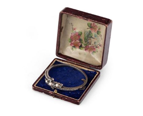 Edwardian silver ornate bangle, set paste stones, with white metal safety chain, in associated period box, 65mm diameter, 15.